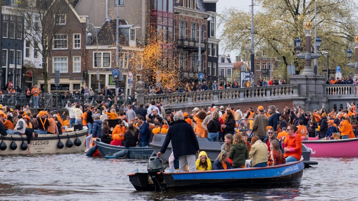 a large group of people in boats on a river
