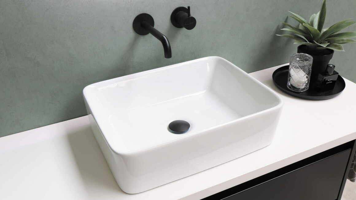 white ceramic sink with stainless steel faucet